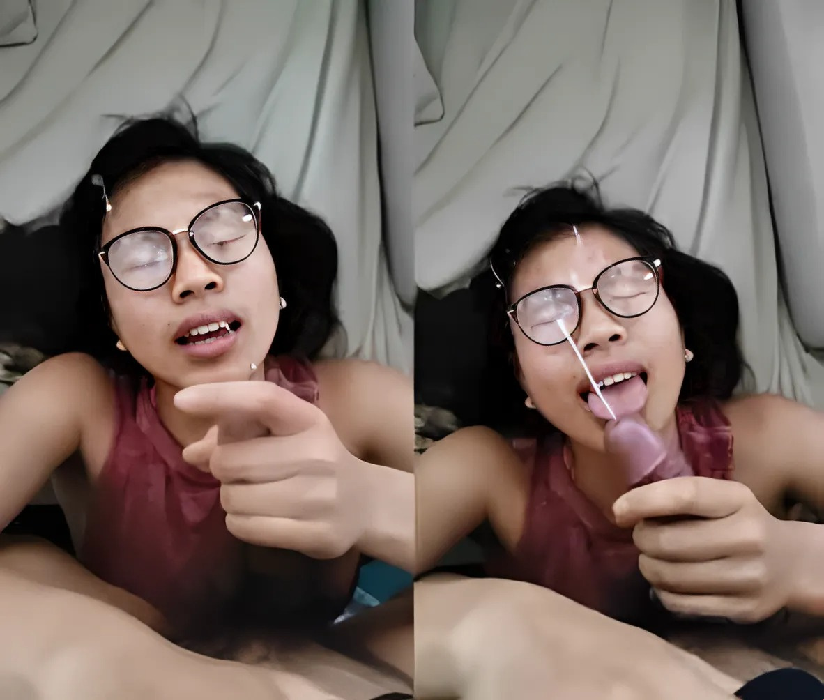 The bespectacled girl loves having cum on her face